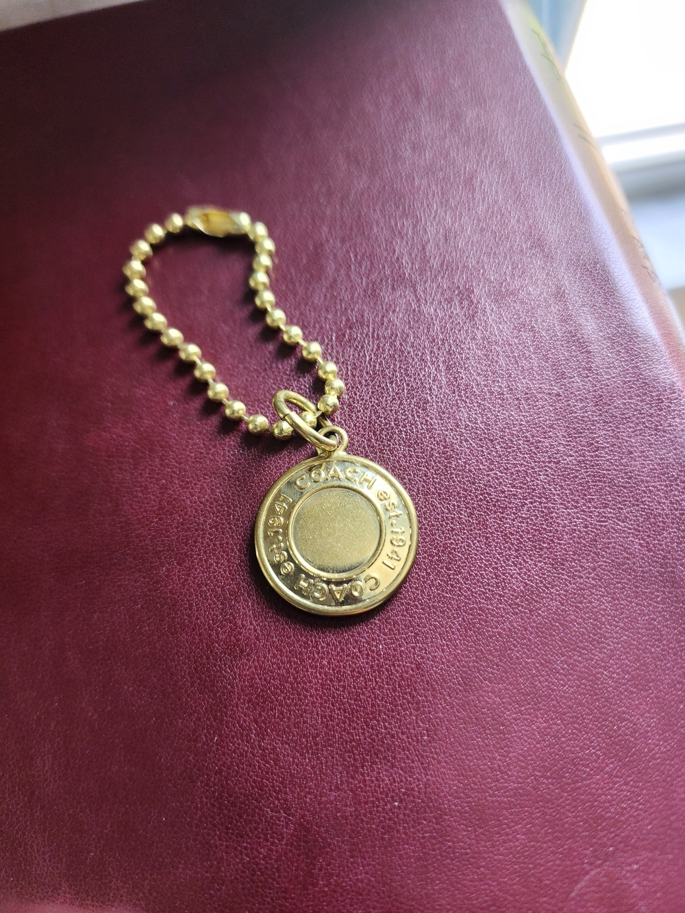 Coach 1941 gold-tone medallion/ Keychain/ Charm